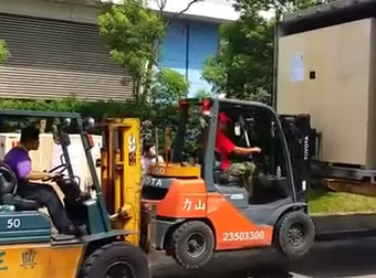 This Is The Coolest Way To Load A Box Into A Truck. Forklift Fans, Prepare Yourselves.