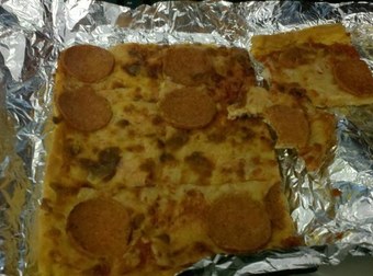 The Smartest Person In The Universe Figured Out How To Turn Disgusting Leftover Pizza Into Delicious Cheese Magic.