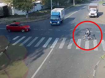 Russian Cyclist Miraculously Avoids Injury After A Terrible Car Crash.