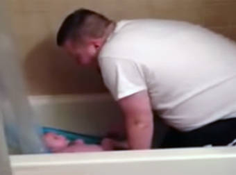 Dad Caught Singing A Funny Song To His Son During Bath Time.