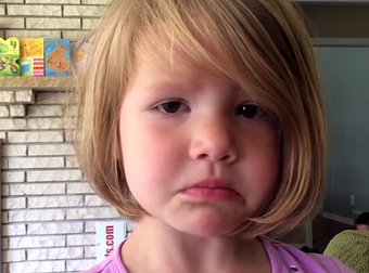 Little Girl Unhappily Discovers The Permanence Of Deleting Photos Off A Camera.