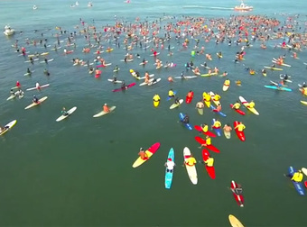 Watch Thousands Of Surfers and Kayakers Paddle Out To Sea Together To Honor Their Dead Friend.