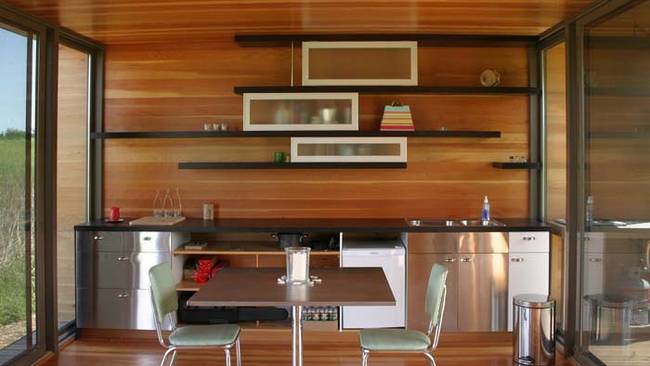 The inside features a full kitchen, Douglas fir details, and floor-to-ceiling windows. Who said tiny living can still be luxury living?