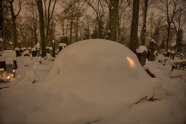 The many blankets of snow only contribute to the graveyard's beauty.