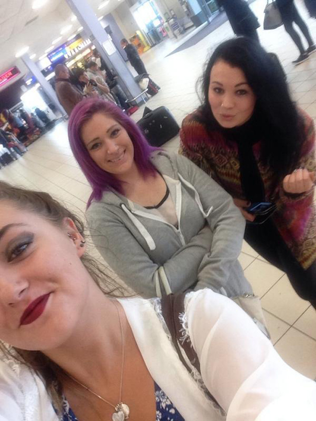 All three ladies waiting for him at the airport.