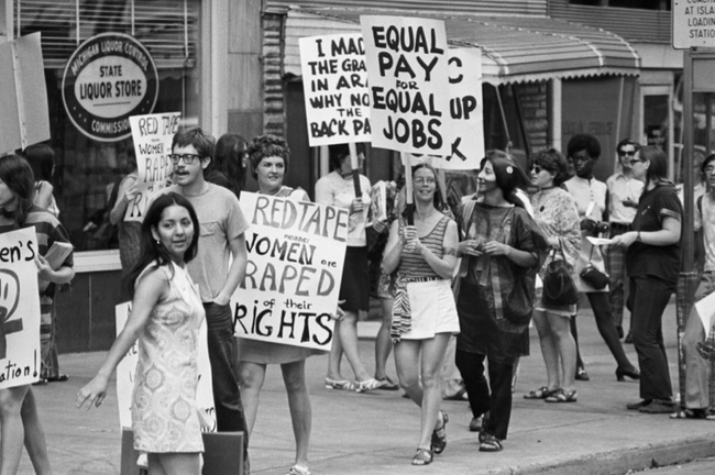 20.) Women's Liberation Coalition marching for equal pay in 1970.