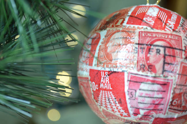 He gained his love of stamps from his grandfather, who was also a stamp collector. He decided to use these collected stamps to decorate one-of-a-kind Christmas tree ornaments.