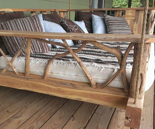 17. Take a nap on a cozy <a href="https://www.etsy.com/listing/106833638/porch-swing-bed-queen" target="_blank">porch swing bed</a>.