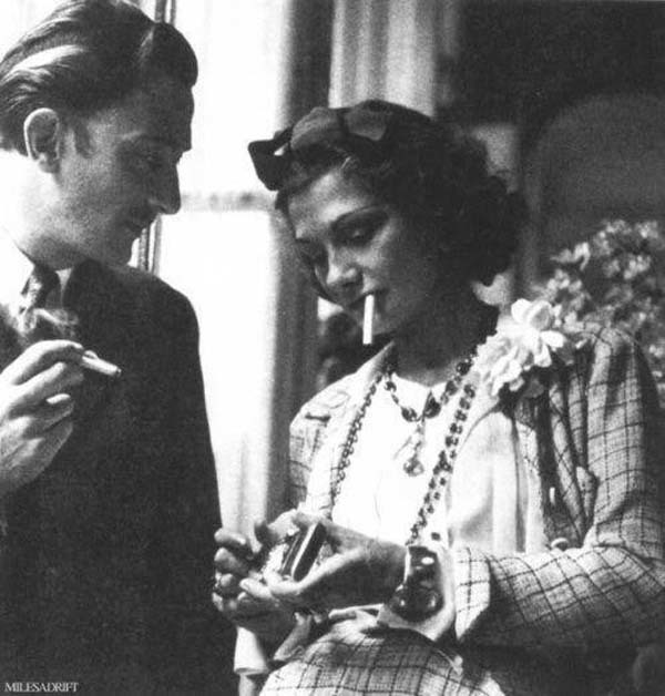 23.) Salvador Dali and Coco Chanel sharing a smoke break (1938).