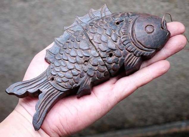 A fish-shaped lock from China, made of rosewood during the Qing Dynasty (1644-1912).