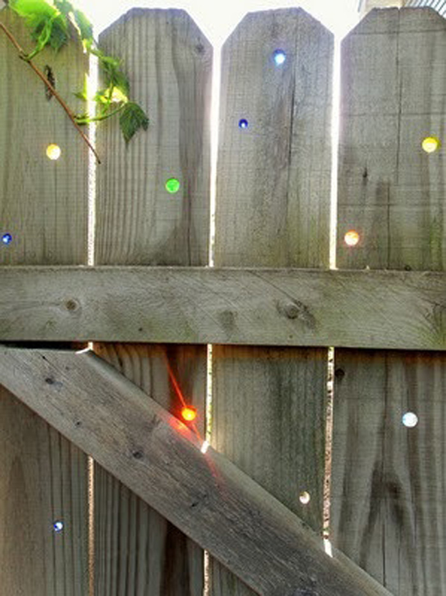 13.) Plug up the holes in your fence with marbles.