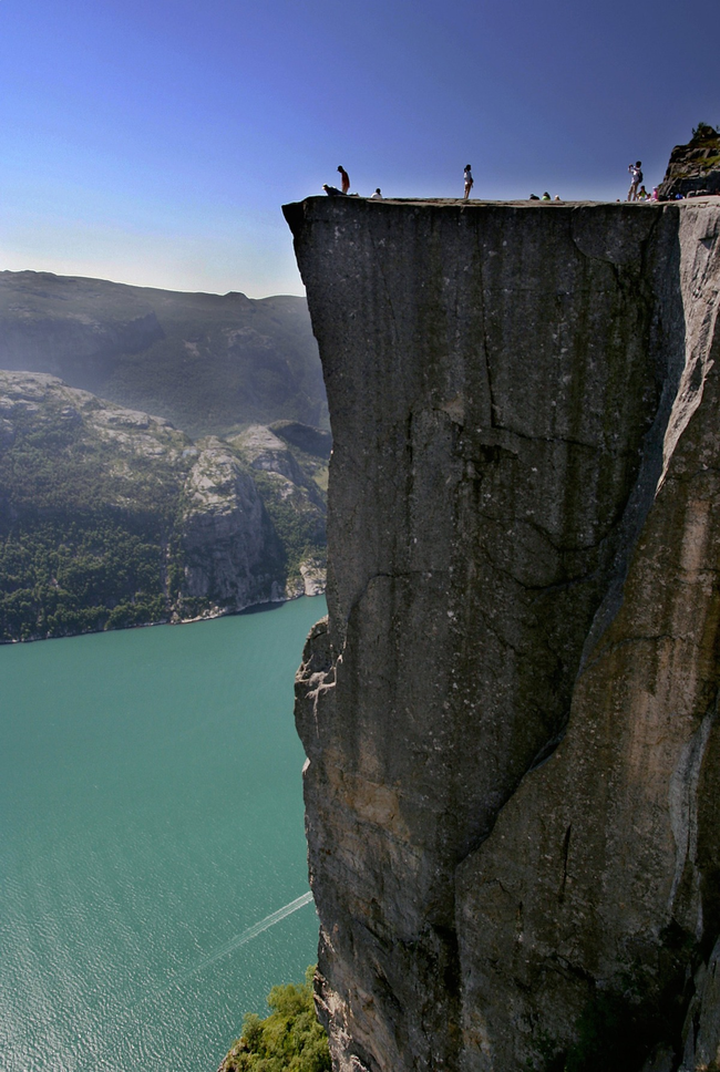 The cliff has a sheer 2,000-foot drop into a fjord.