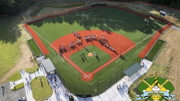 36.) Two baseball teams listen to the National Anthem before a game (Virginia Beach, Virginia).