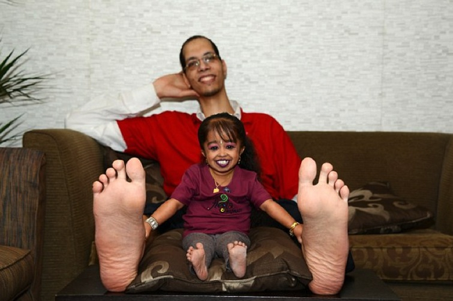 Here she is with the man with the World's Biggest Feet.