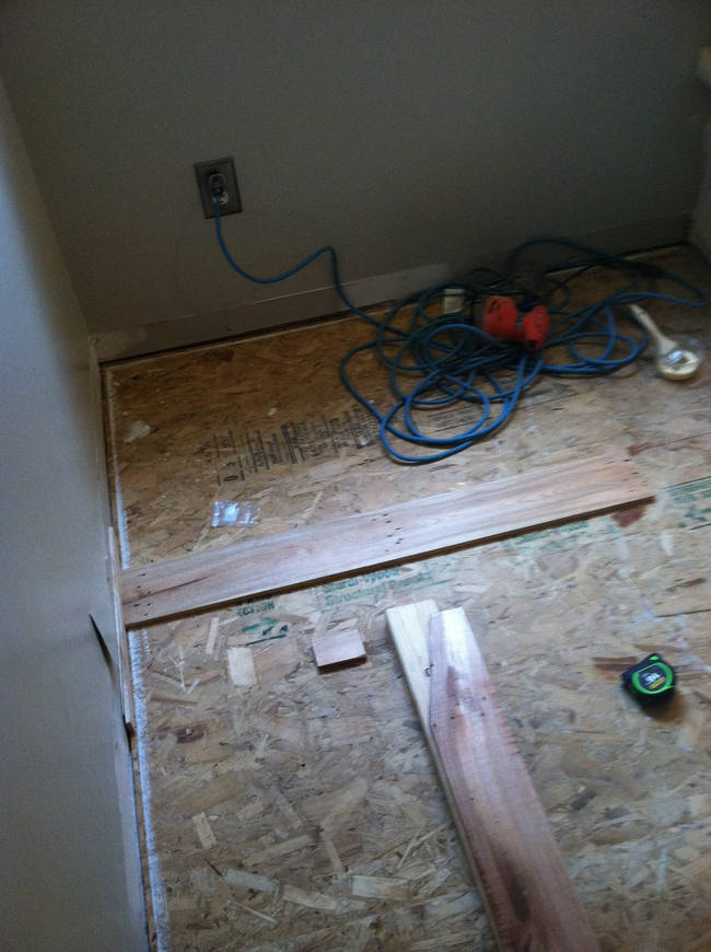 Once all the wood was sanded and refinished, it was time to begin assembling the hardwood floors. This took a considerable amount of time.