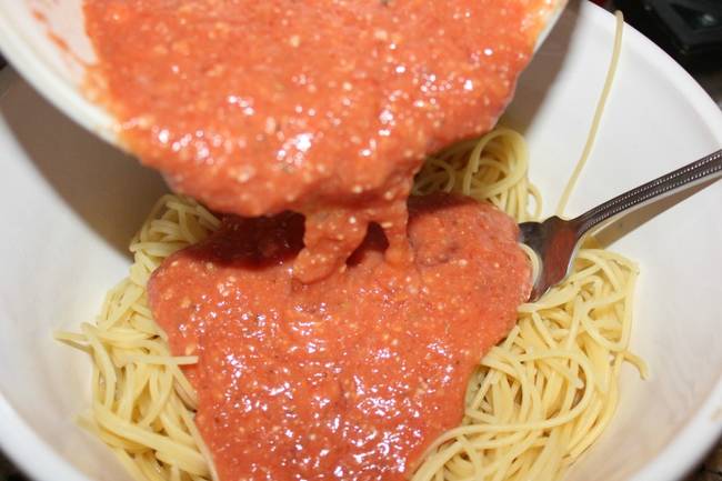 Add your sauce mix to the cooked spaghetti and mix it all together.