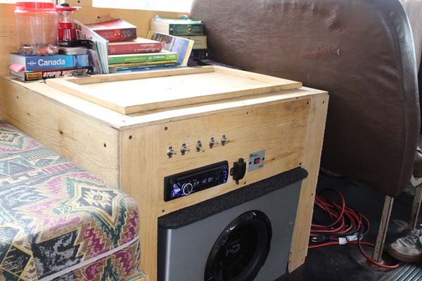 The electric box. "The switches are for the water pump, stereo, sub, inverter (converts 12v to 110v so we can run the appliances without hooking up to electricity), lights and the fridge."