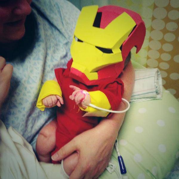 His newborn son looks like a real mini-superhero after getting dressed up in the costume.