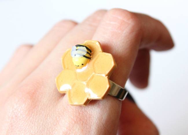 This one is adorable - a little tiny bee on a piece of honeycomb.