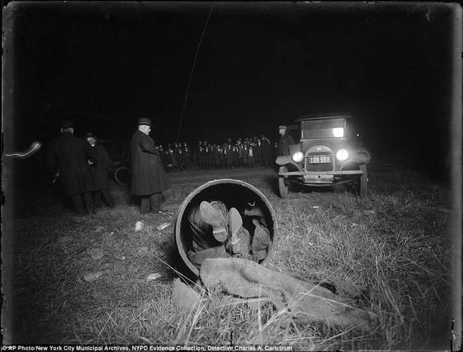 6.) A crime scene in 1918. The body was stuffed in a barrel and dumped in a field in Brooklyn, NY.