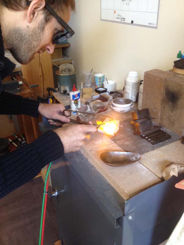 "We are getting married this summer. We opted to make our own rings and decided on fairly simple 18k white gold bands. The raw material is melted and poured into a cast."