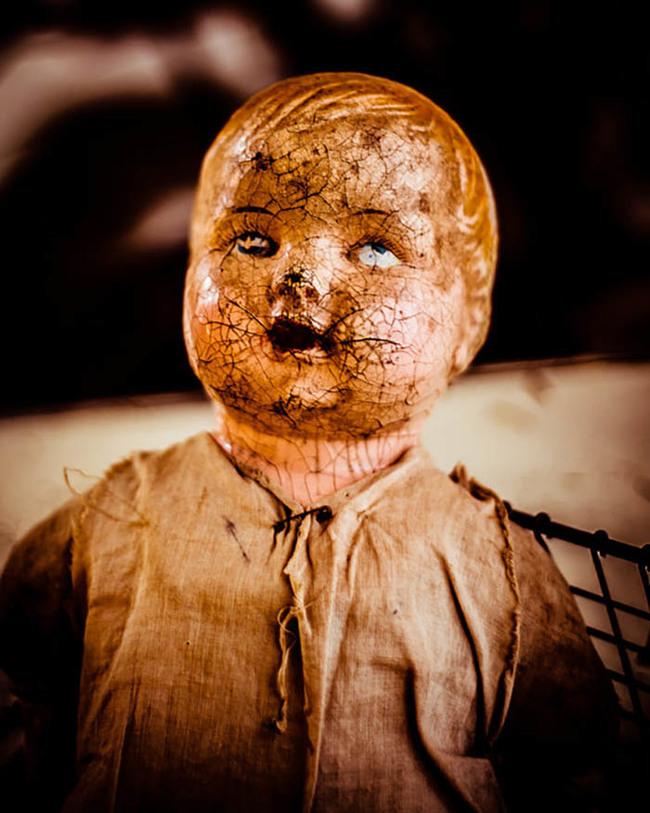 15.) Baby Doll - "I know what would fix this doll right up, some clown makeup!" - a toymaker from the old days