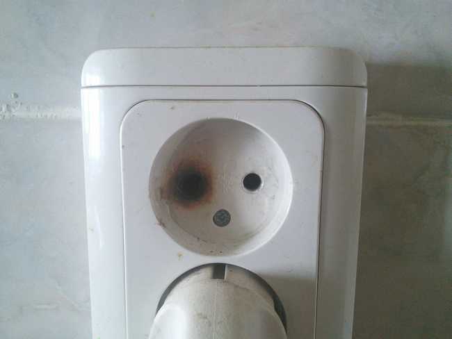 19. This electrical outlet looks like someone who got into a fight.