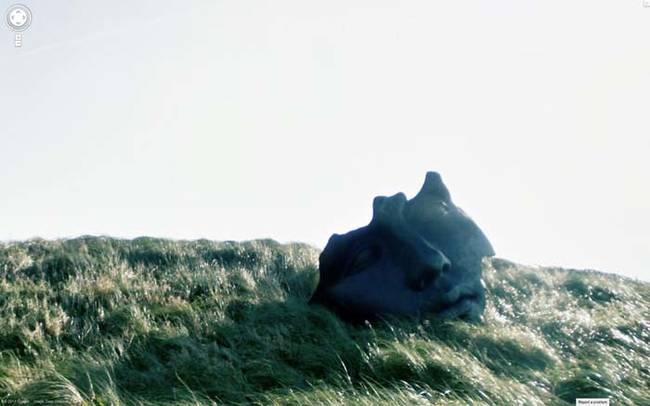 The broken face on the hillside.