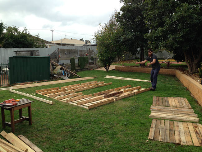 Then they began fitting the wooden pallets together.