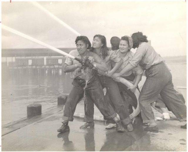 Women training as firefighters during WWII in Pearl Harbor.