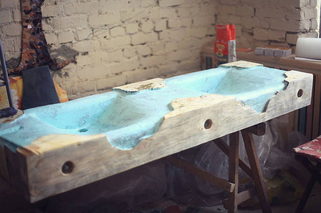 Here's when the sink really started coming together. At this stage, the team waterproofed the wooden sink.