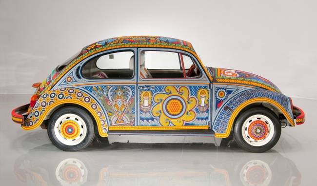 This is a Vochol, a cross between the Spanish word for the Beetle car ("voch") and the word "Huichol." It took seven months to create this car's look.