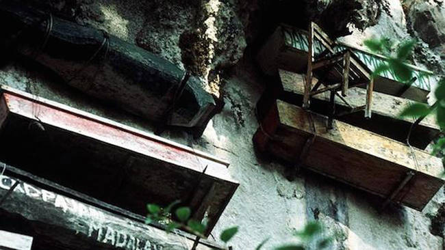 The small coffins are made from one piece of wood and sometimes require breaking the bones of the deceased in order to fit.