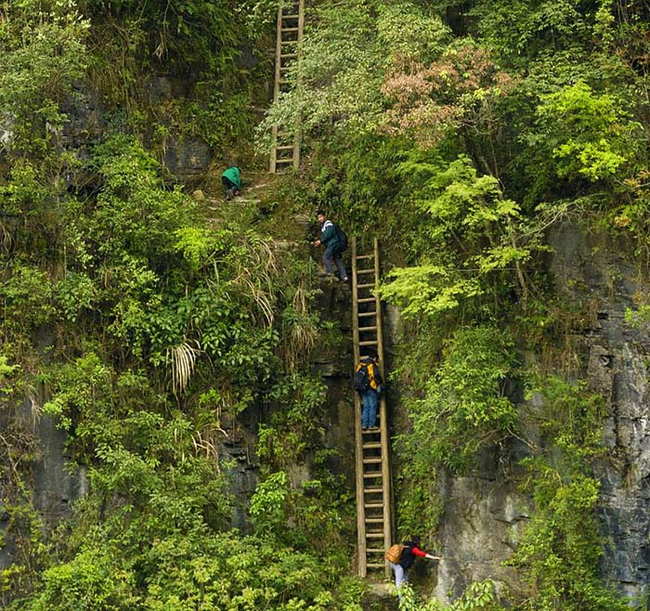 8.) Zhang Jiawan Village, Southern China - The kids here have to climb up huge, rickety ladders to get to school.