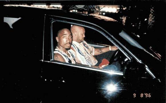 2.) Tupac Shakur sits with his manager Suge Knight before he was shot to death in a drive-by on September 13, 1996.