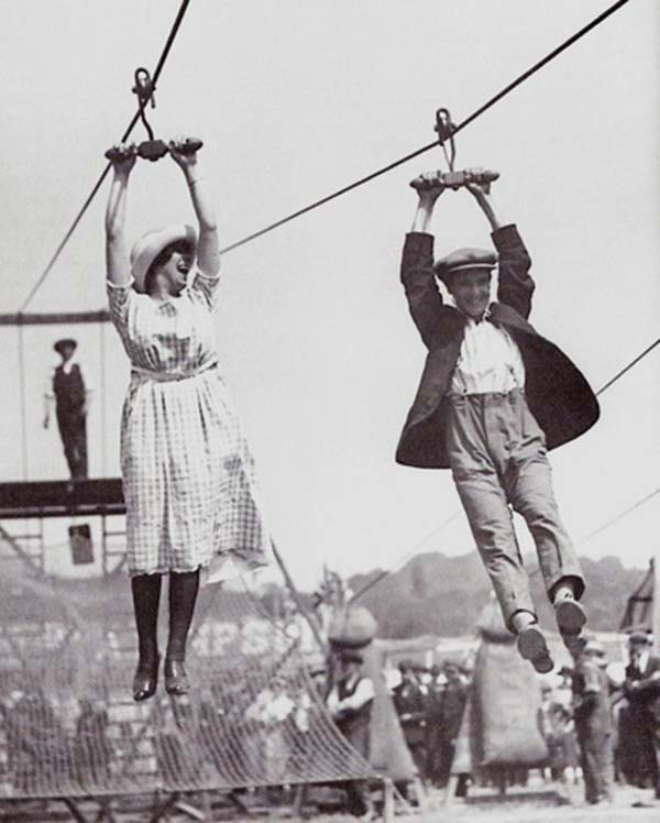 11.) A couple enjoys an old-fashioned zipline at a fair (1923).