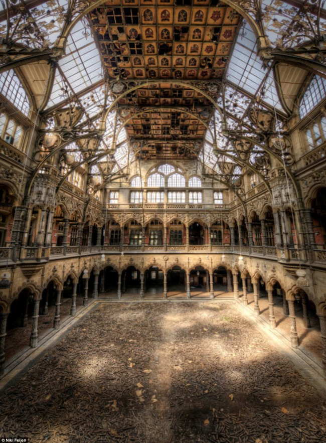 Another larger building is being slowly reclaimed by nature.