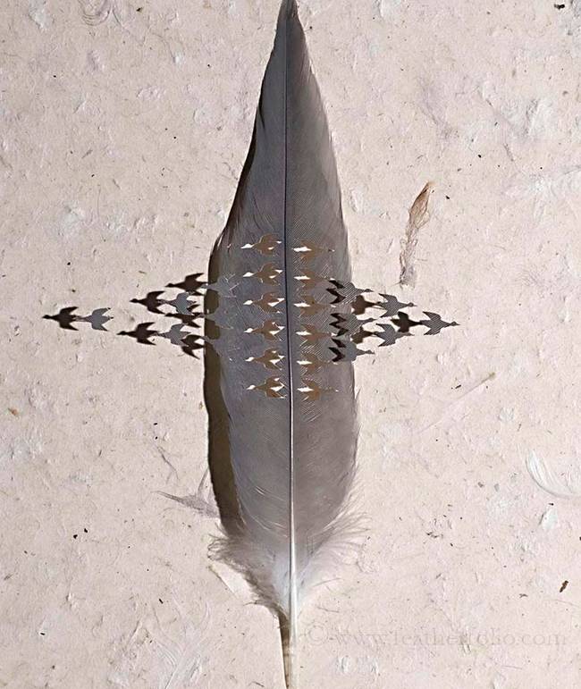 This Escher-like piece is created on a demoiselle crane feather, which is about 14 inches long.