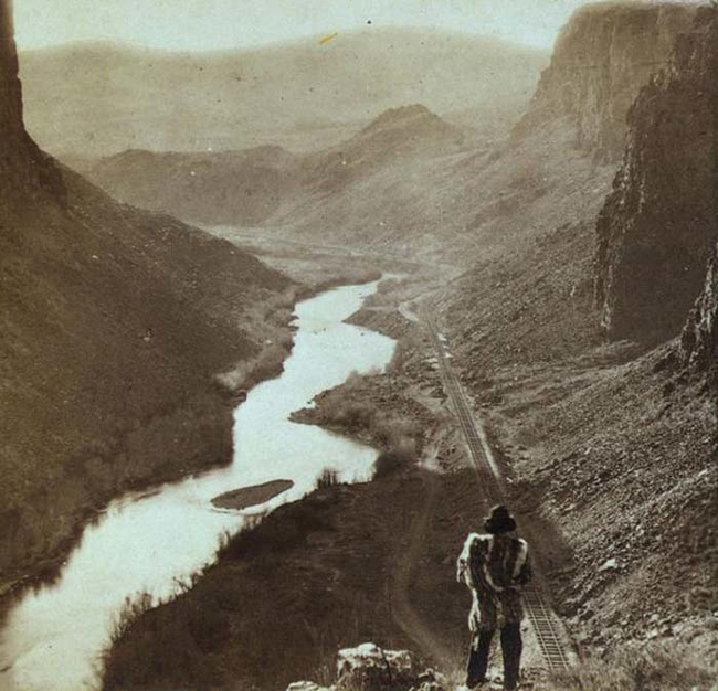 21.) 1868 - A Native American observers the completed Transcontinental railroad.