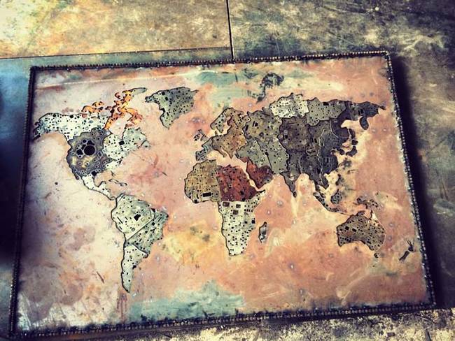 4.) A map of the world made from scrap metal.