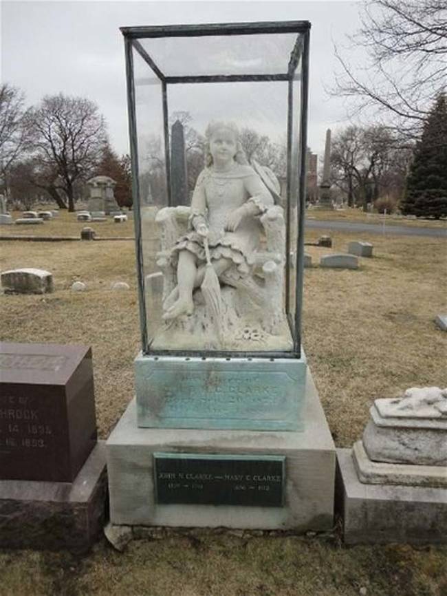 This life size girl in the glass box grave was commissioned by the girl's mother.