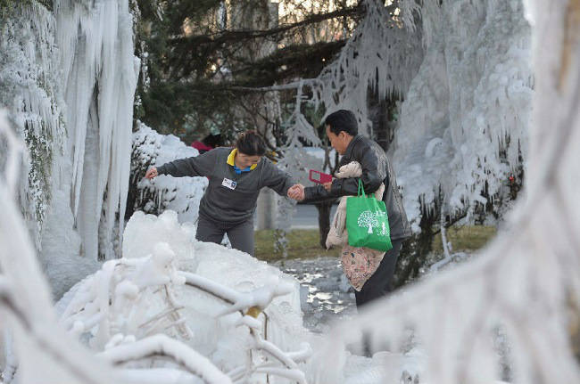 The water, at a temperature of 22 degrees Fahrenheit, quickly froze to anything it could after pipes burst at 5 AM.