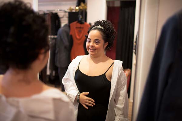 When she saw her hair and makeup in the mirror for the first time, she just had to laugh.