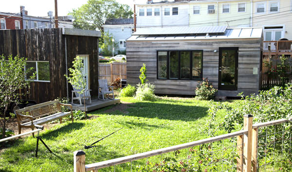 Not only is this house spatially efficient, but it is also very efficient in the uses of energy and resources. Two environmentally friendly modifications on this tiny house are it's use of solar energy, and it's use of rain water as a water-source.