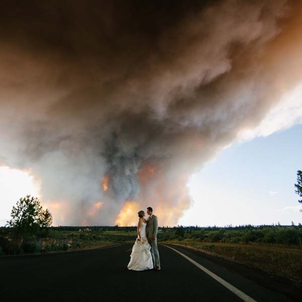 Josh Newton, their photographer, made sure to take pictures of both the ceremony and the fire in the background.