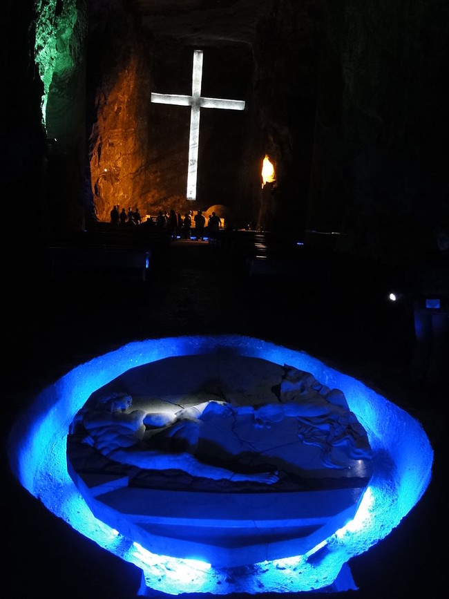 This sculpture shows the creation of man, modeled after Michelangelo's Sistine Chapel painting. The sculpture is carved from the rock salt, and illuminated with colored light.