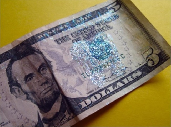 A little glitter on money is a nice "tooth fairy" touch.