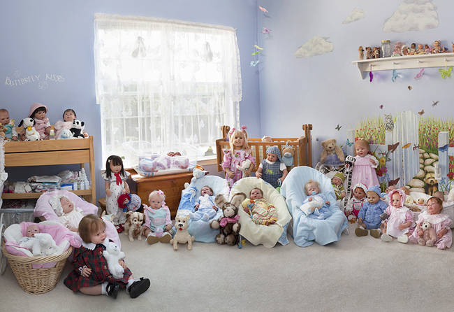 A collector's room full of dolls, all of which have been repainted to look as realistic as possible. It's certainly not a look for everyone, but for some, it's a great hobby.