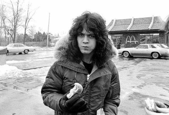 5.) Eddie Van Halen munching on a burger.