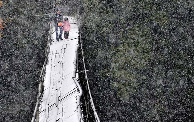 4.) Dujiangyan, Sichuan Province, China - The only way to school here is over this nearly broken bridge. The snow probably doesn't make the journey any easier.